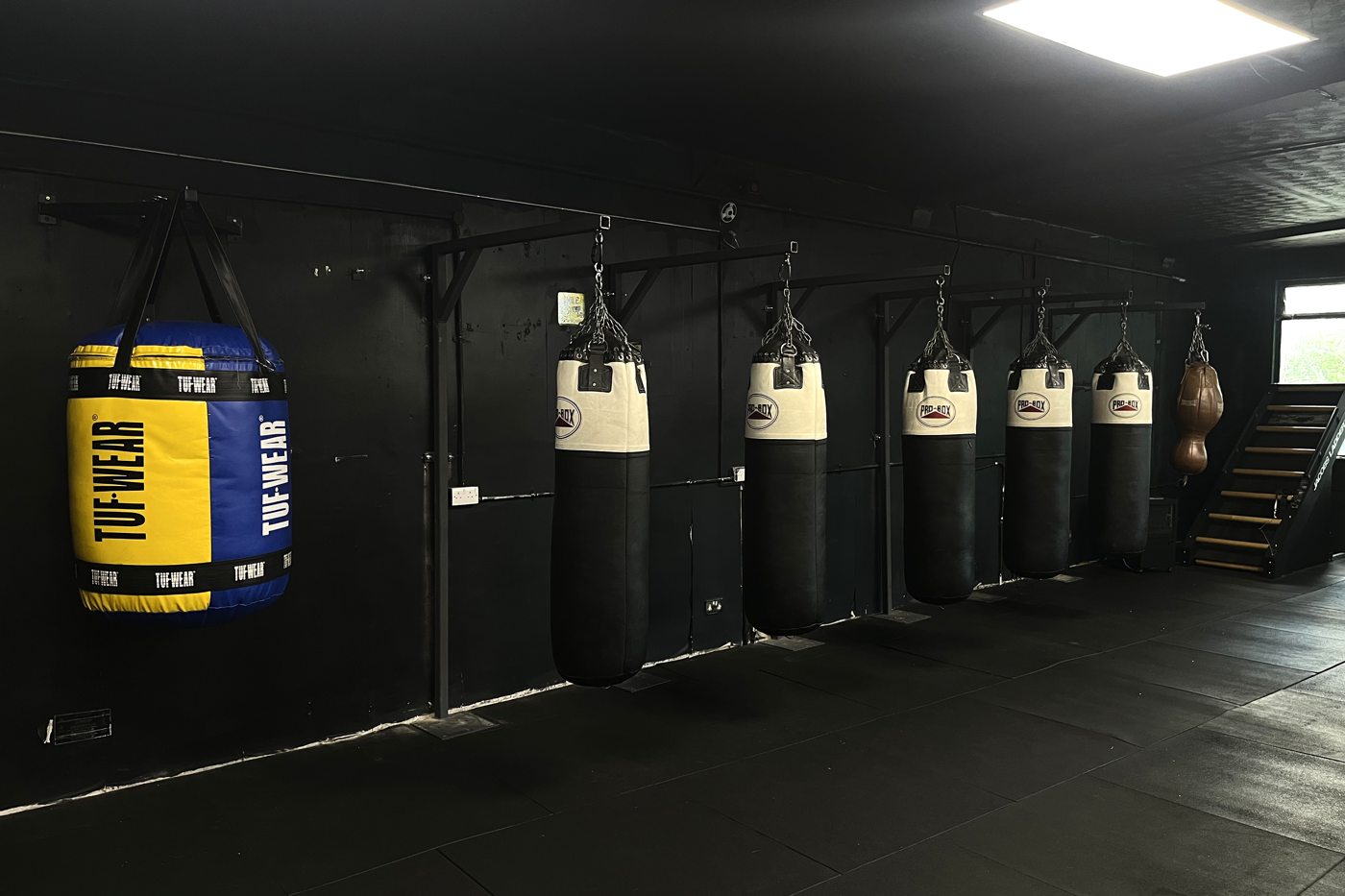 The heavy bag wall at Boxwright Academy